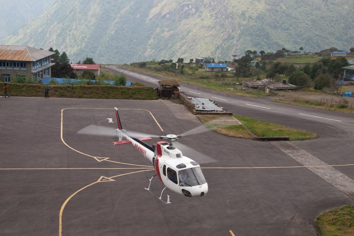 Lukla Airport runway and helicopter Nepal